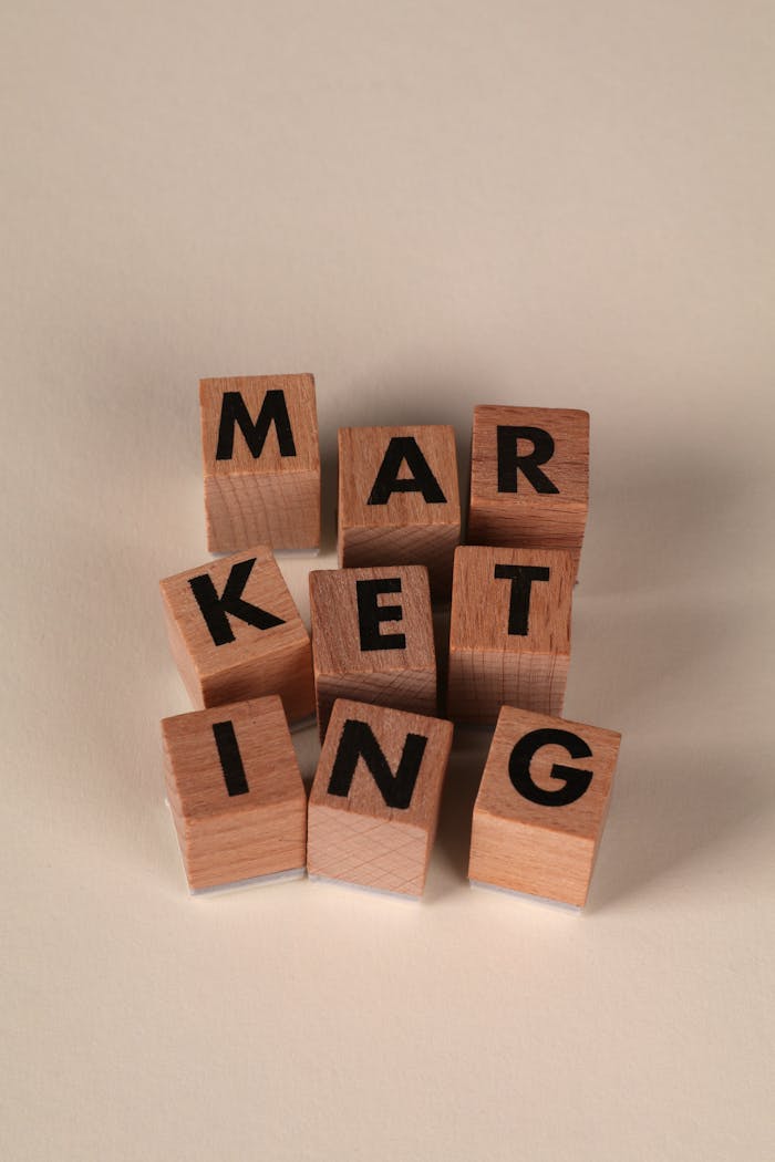 gallery-2 Wooden blocks arranged to spell 'MARKETING' on a neutral background.