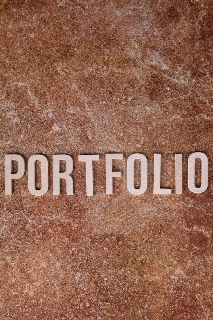 gallery-1 Portfolio text on a textured stone background, perfect for business themes.